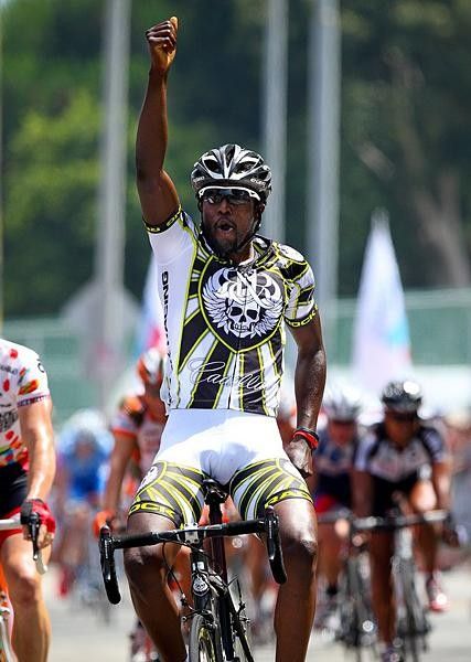 Rahsaan Bahati does the running man salute after repeating in Manhattan Beach.