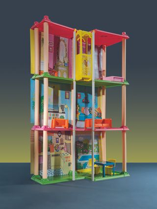 Open-fronted three-level dollhouse, in Barbie Dreamhouse book