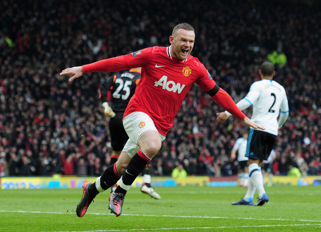 Manchester United's Wayne Rooney celebrates scoring the second goal during the Barclays Premier League match between Manchester United and Liverpool at Old Trafford on February 11, 2012 in Manchester, England.  (Photo by Shaun Botterill/Getty Images)