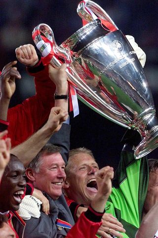 Sir Alex Ferguson and Peter Schmeichel lift the Champions League trophy