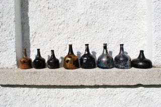 These glass wine and spirit bottles found at Rathfarnham Castle were likely made in the 1650s.