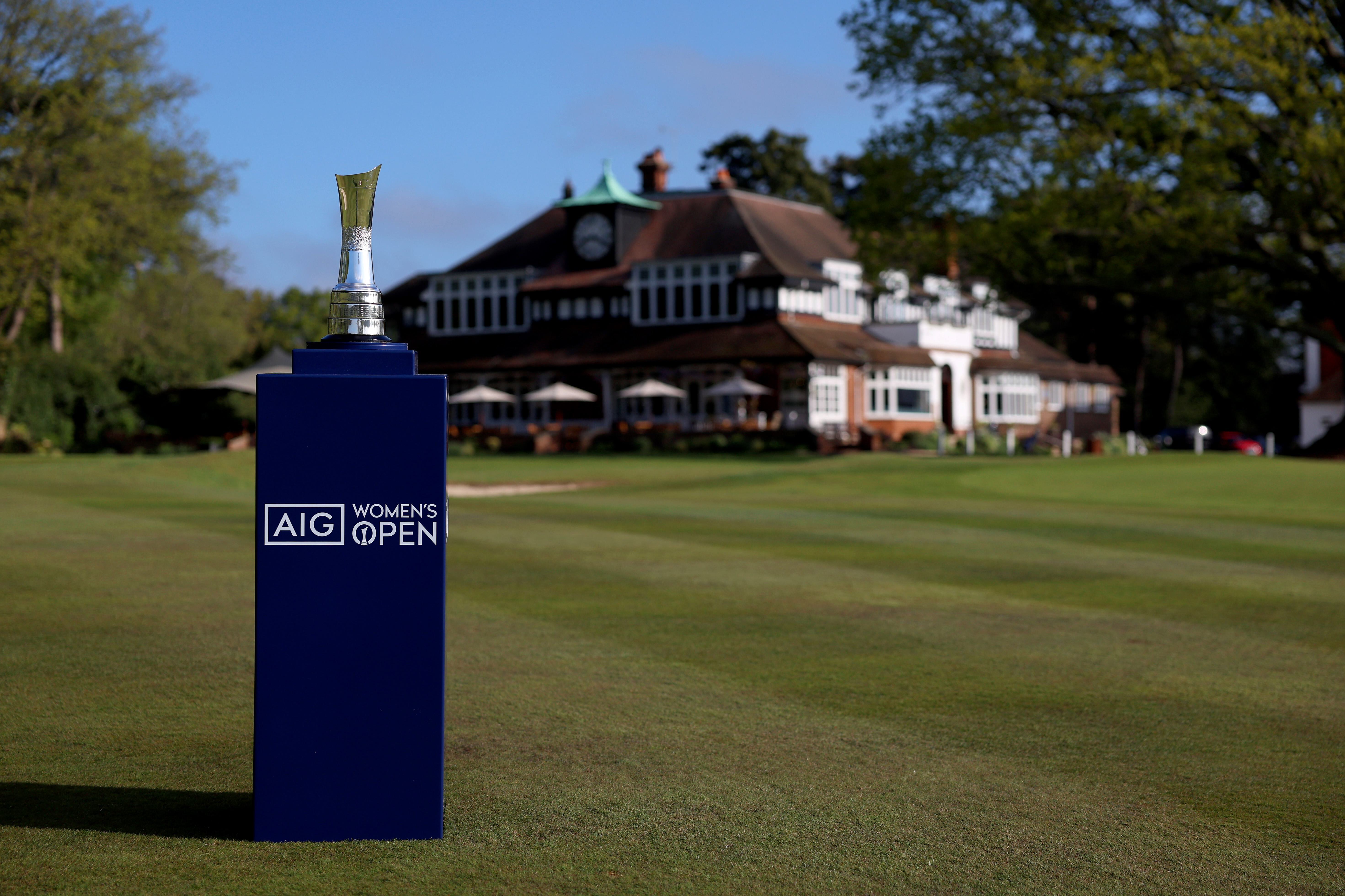 The AIG Women's Open trophy stands in front of the clubhouse at Sunningdale Heath Golf Club