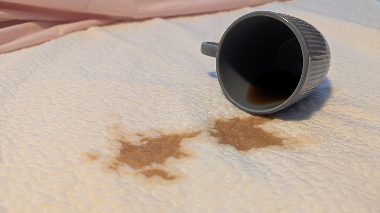Coffee stain on a white mattress protector