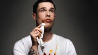 Detail from Ed Gamble poster showing the comedian with ketchup and mustard on his face and T-shirt