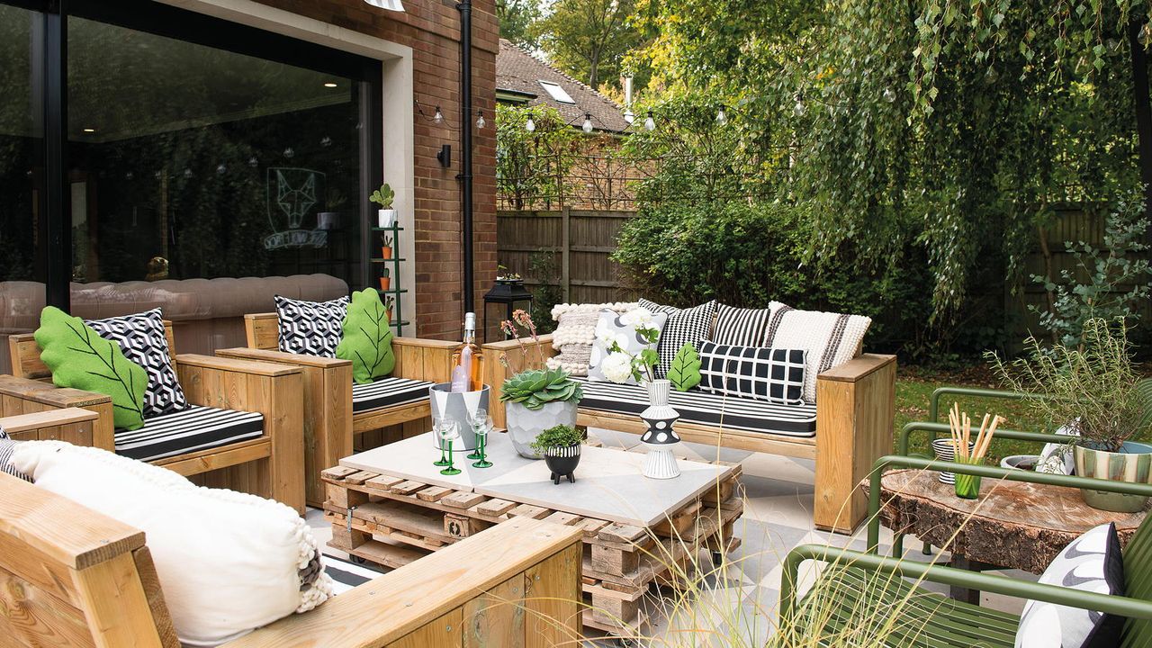 garden patio with outdoor furniture and pallet table