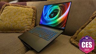 The Razer Blade 16 (2025) on a couch.