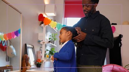 first day of school traditions illustrated by Dad brushing girls hair while dressed in blue cardigan