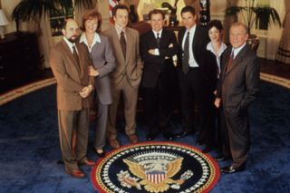 Richard Schiff, Allison Janney, Bradley Whitford, Martin Sheen, Rob Lowe, Moira Kelly, and John Spencer in The West Wing