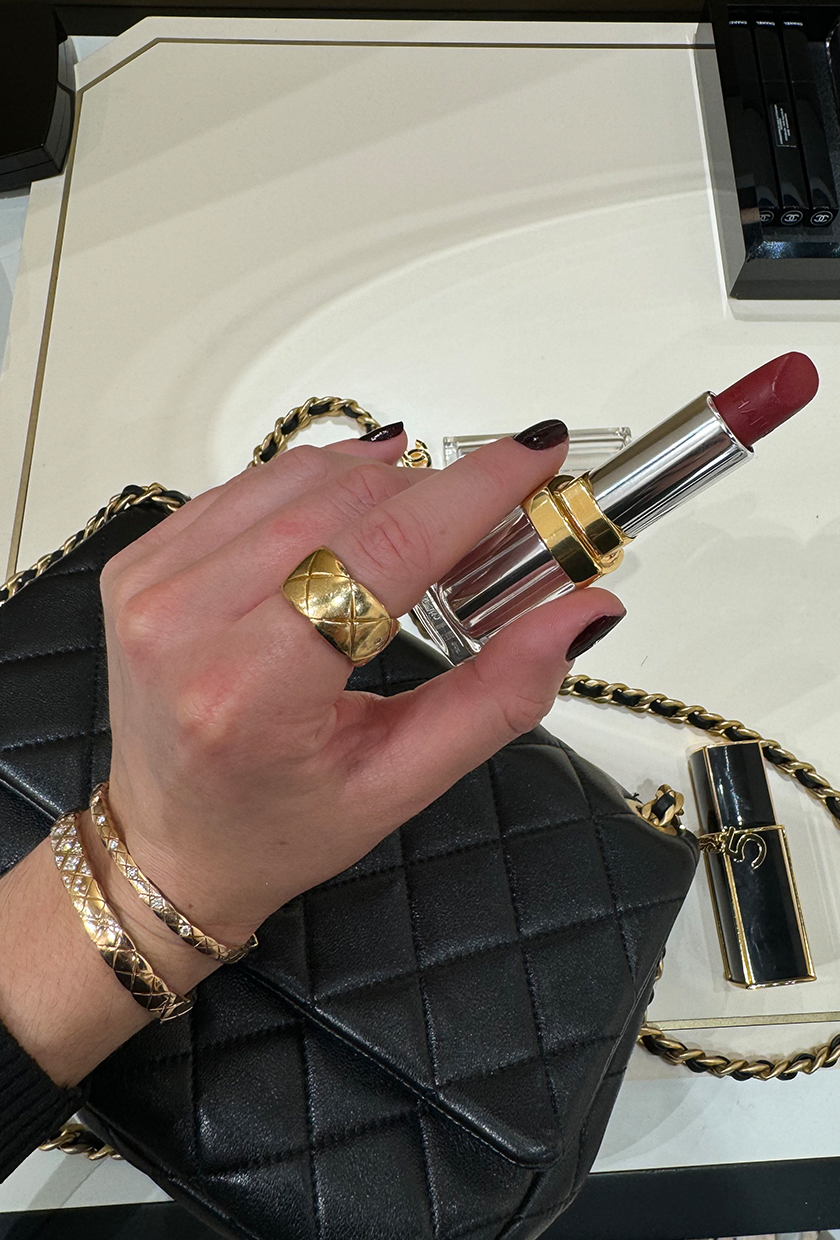 Chanel Le Rouge 31 Lipstick with a black chanel bag and jewellery