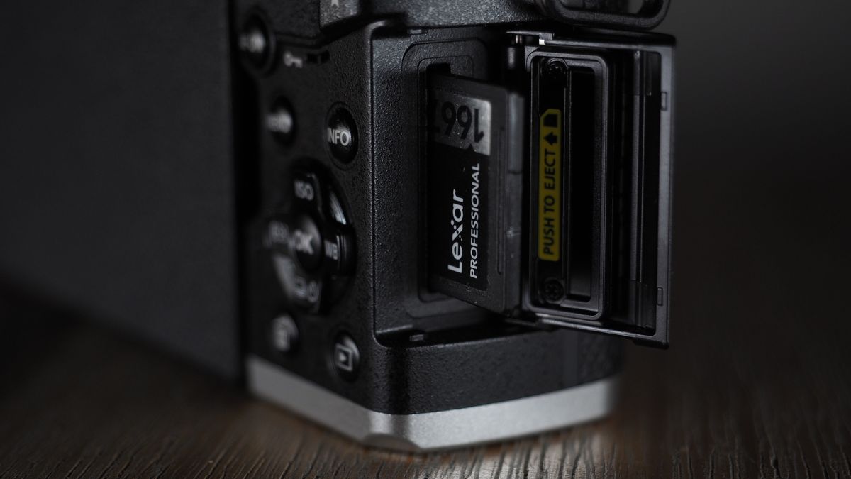 OM System OM-3 on a wooden surface