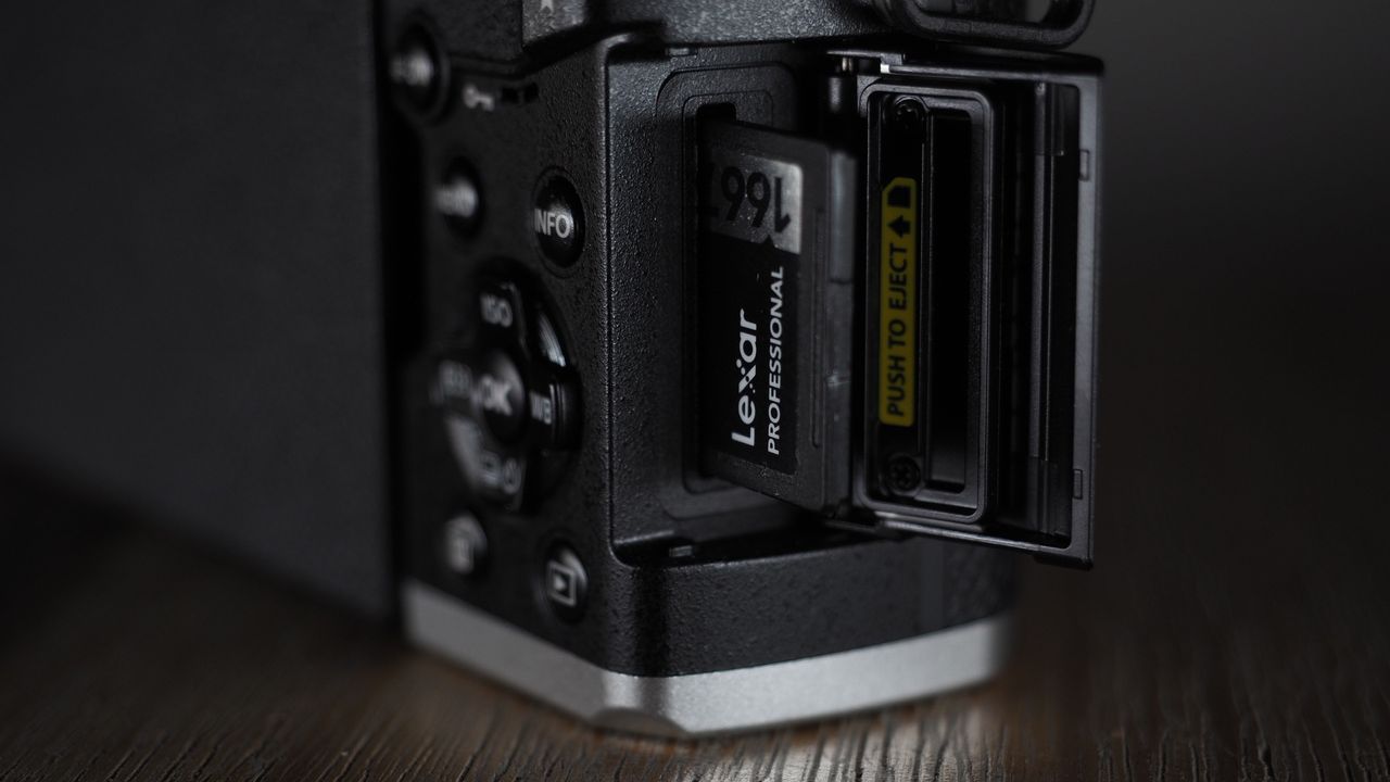 OM System OM-3 on a wooden surface