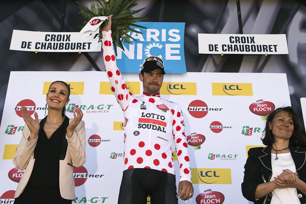 Thomas De Gendt celebrates his best climber's polka dot jersey on the podium at the end of the fourth stage.
