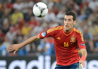 Spain's Sergio Busquets keeps his eyes on the ball against France at Euro 2012.