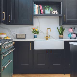 Black shaker kitchen with sink and shelf above