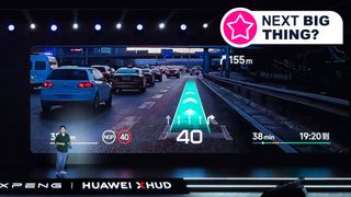 A man on stage presenting the Xpeng Light-Chasing Panoramic Display