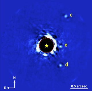Gemini Planet Imager (GPI) photo of the planetary system HR 8799, showing three of the system's four known planets. (The star is in the middle; planet b is outside the field of view shown here, off to the left.) These data were obtained on Nov. 17, 2013, 