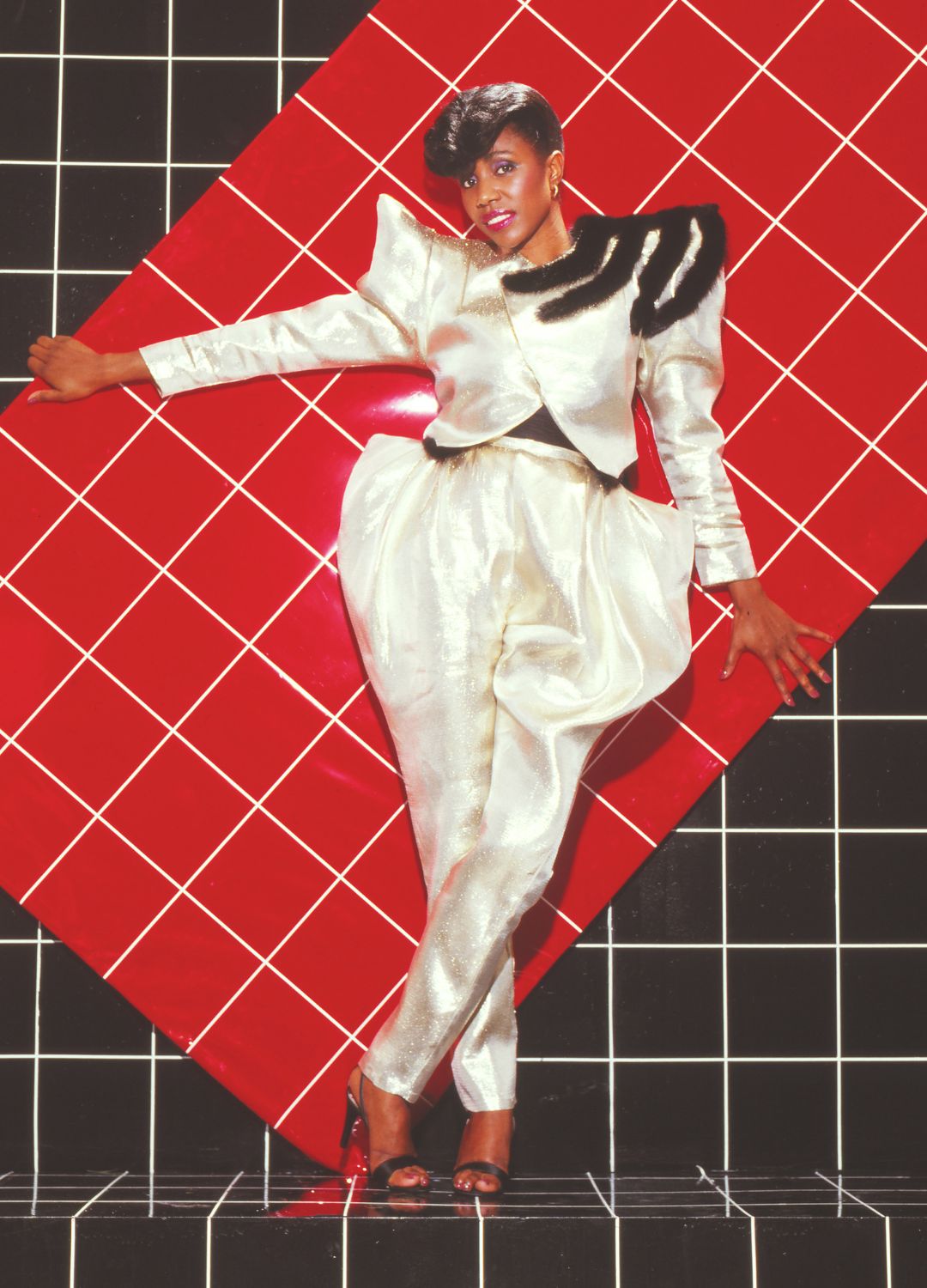 Singer and songwriter Syreeta Wright poses wearing a silver Lame jumpsuit with shoulder pads and parachute pants by designer Ellene Warren circa 1980