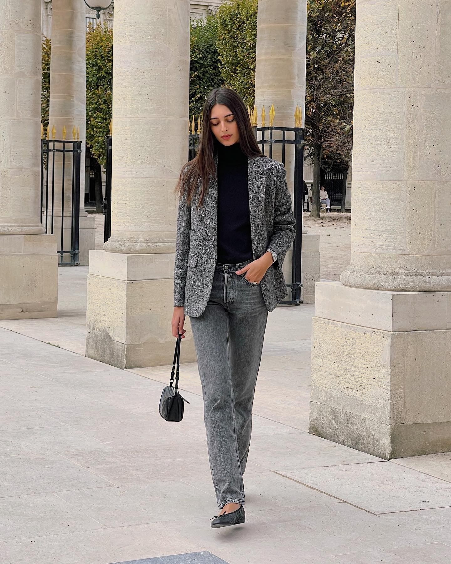 Fashion person wears the grey jeans and ballet flat trend