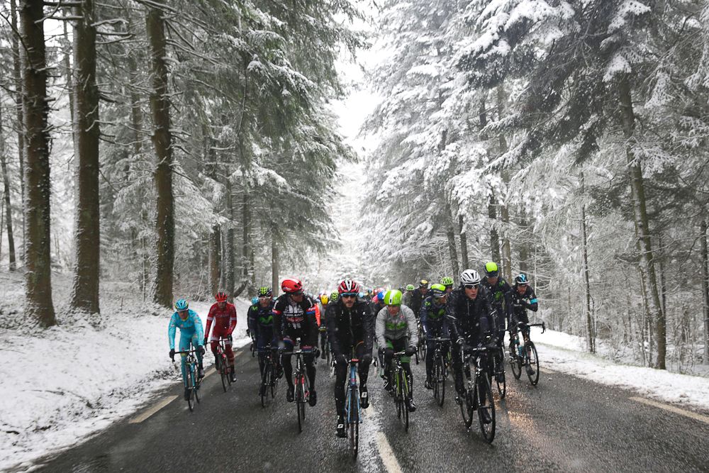 Pack rides under the snow during the third stage of the 74th edition of the Paris-Nice