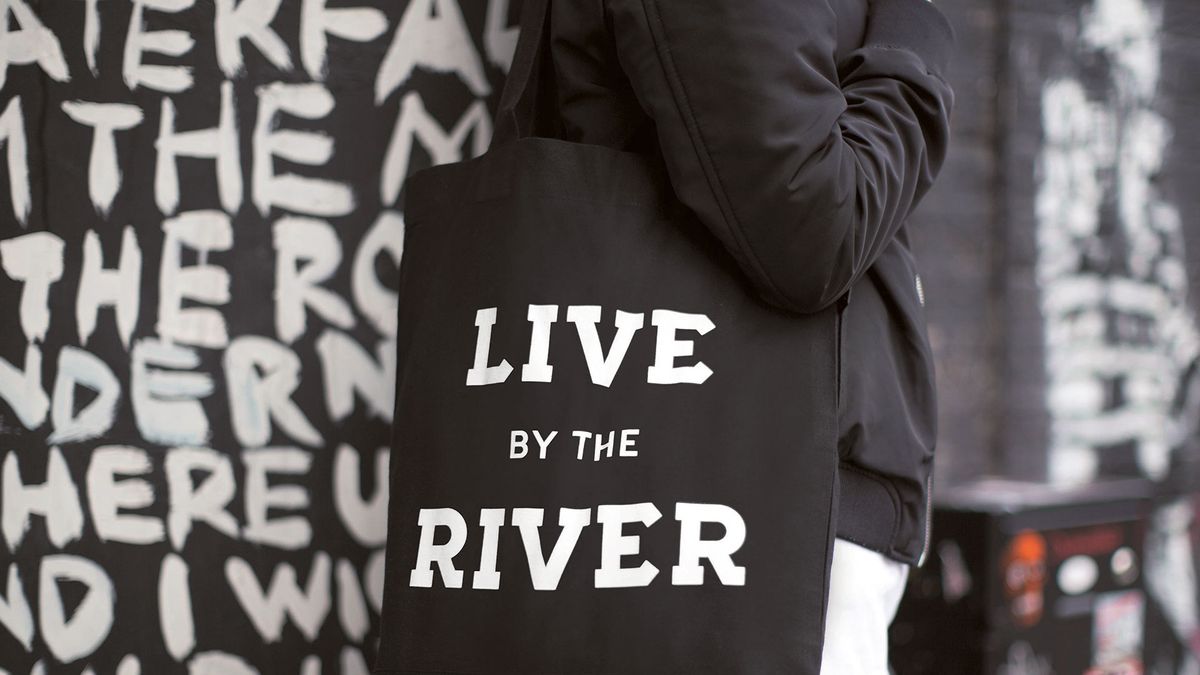 Camden market tote bag reading &#039;Live by the river&#039;