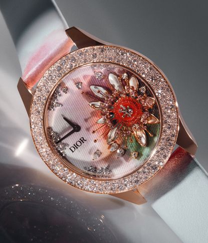 White dior watch with a red flower on the dial
