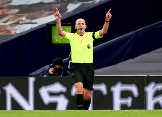 Referee Mike Dean disallows a goal scored by Aymeric Laporte during Manchester City's 2-0 loss at Tottenham in November having consulted a pitchside monitor. VAR remained a hot topic throughout the season, often adding to controversy rather than eradicating it