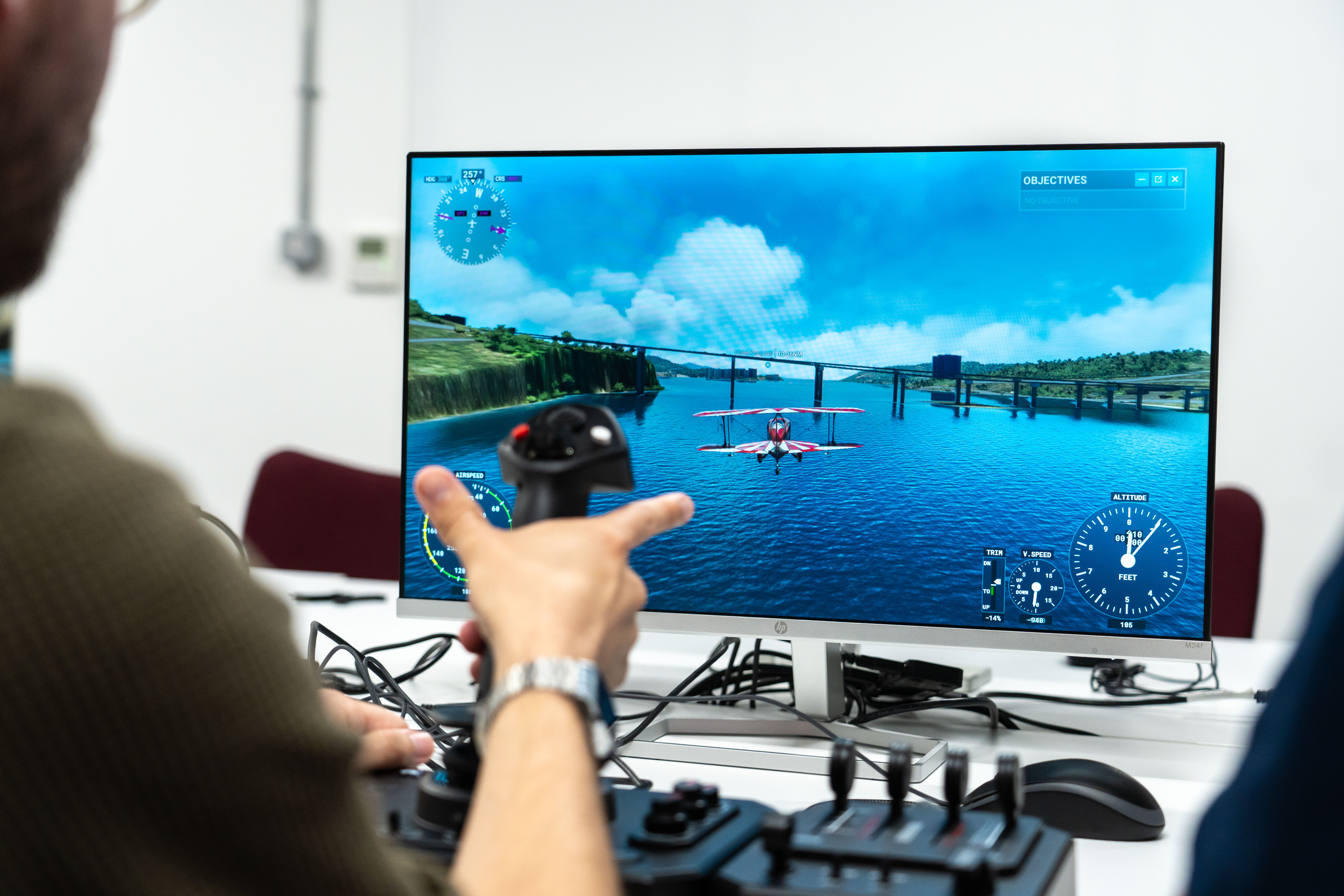 Honeycomb Aeronautical Foxtrot Aviation Stick on a white desk, playing Microsoft Flight Simulator 2020.