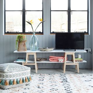 living room with pouffes