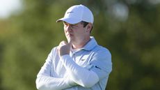 Robert MacIntyre with his finger on his lips pondering while playing at the Alfred Dunhill Links Championship 2026 on the DP World Tour