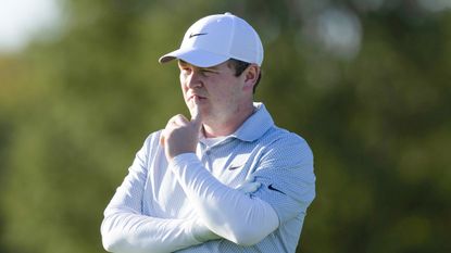 Robert MacIntyre with his finger on his lips pondering while playing at the Alfred Dunhill Links Championship 2026 on the DP World Tour