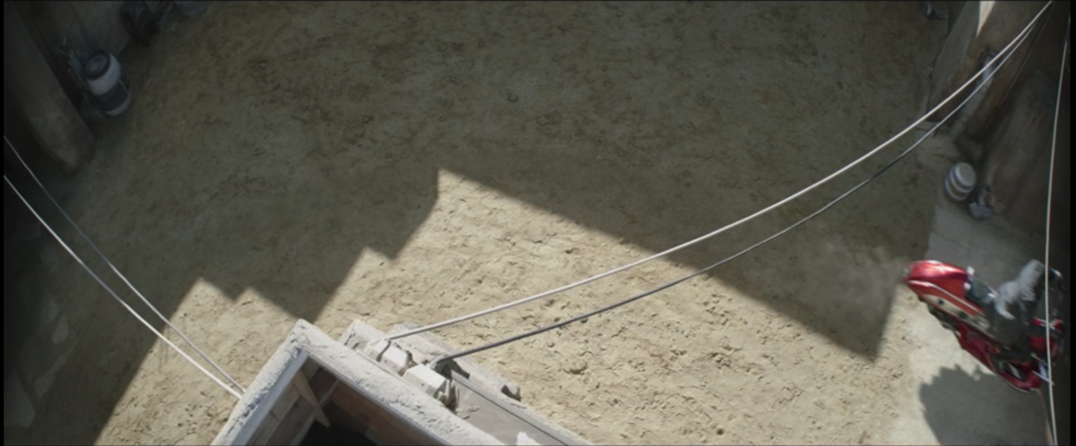 A freeze-frame of The Book of Boba Fett episode 3, showing an exposed bit of facade in the bottom left corner.