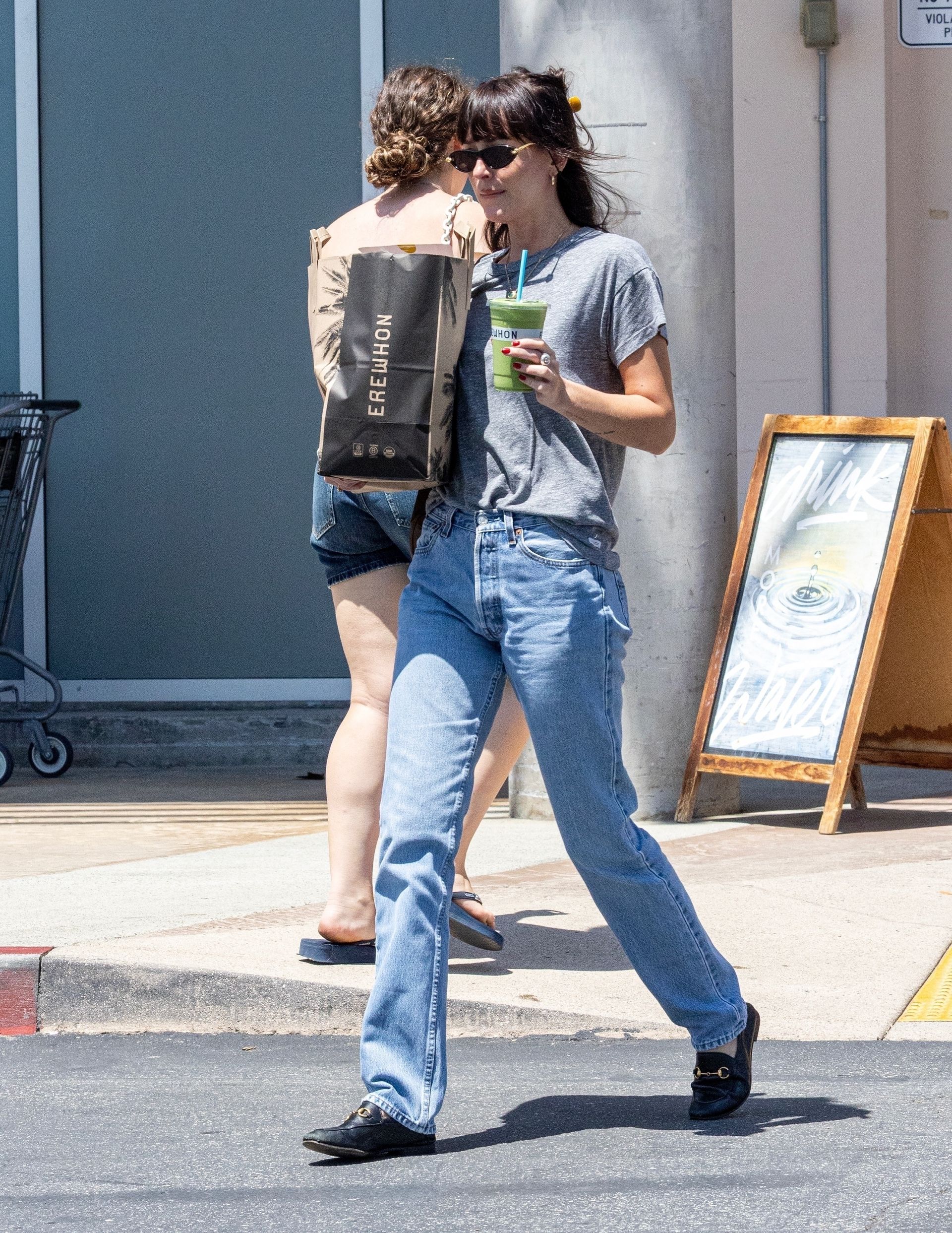 Dakota Johnson wears jeans and Gucci loafers to grab a smoothie and groceries from Erewhon