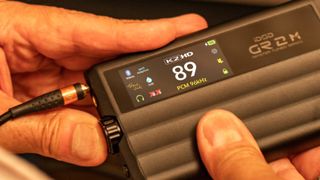 iFi DSD GR2 MT Steven Levine DAC being held 