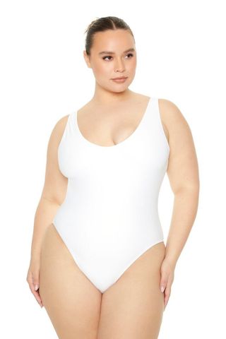 The model wore a low-cut one-piece swimsuit