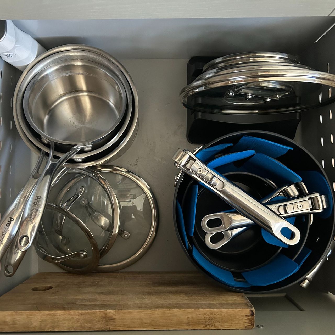 JosephJoseph pan set in drawer next to ProCook set