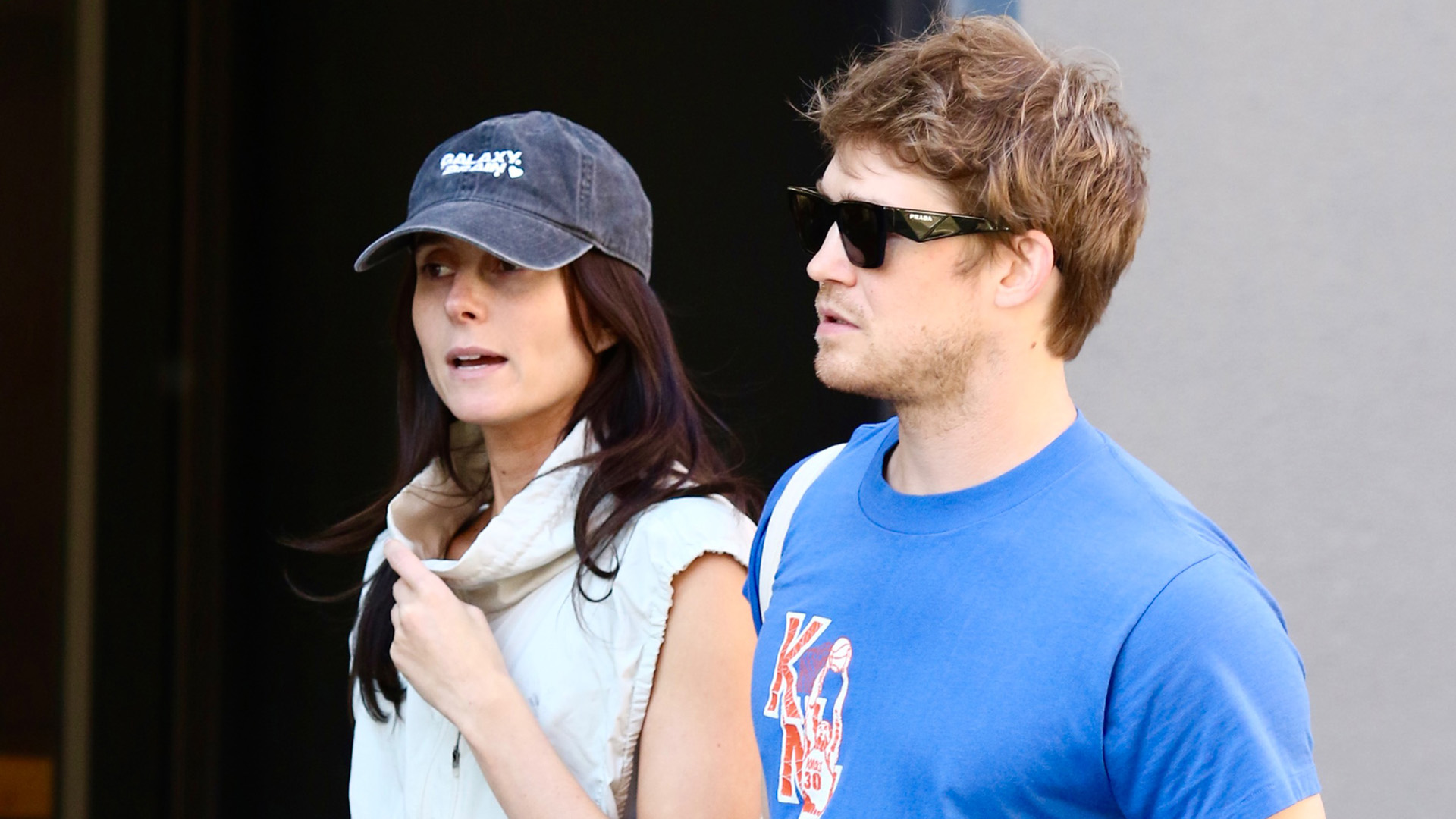 Mary Beth Barone wearing cobalt leggings, walking with Joe Alwyn in NYC