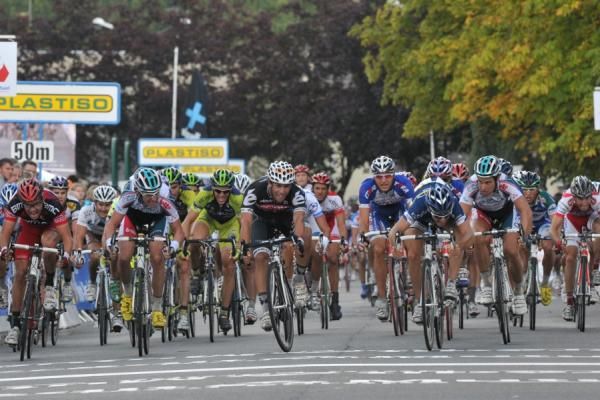 Romain Feillu throws his bike over the line.
