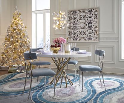 white christmas tree next to an elegant dining table