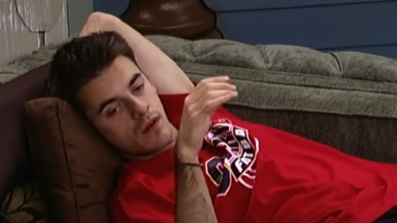 Dan talking to someone on the couch on Big Brother