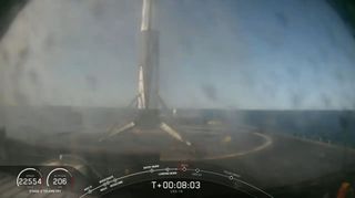 The first stage of a new Falcon 9 rocket stands atop the drone ship Of Course I Still Love You in the Atlantic Ocean after a successful landing on Dec. 5, 2019 following the launch of a Dragon cargo ship to the International Space Station from Florida.