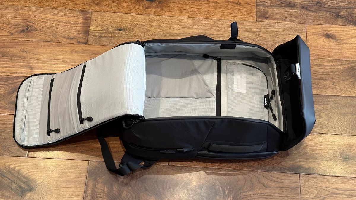 Mous Extreme Commuter backpack on a wooden floor in a living room