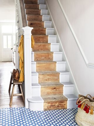 Painted staircase with raw wooden runner