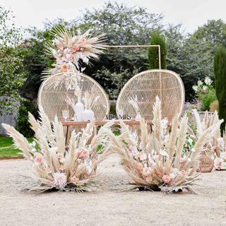 outdoor decorative seating at backyard wedding by Ginger Ray