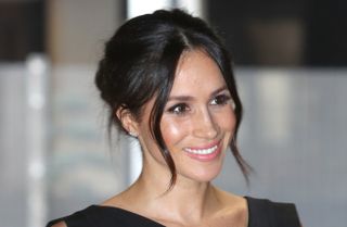 Meghan Markle's hair styled in a messy bun