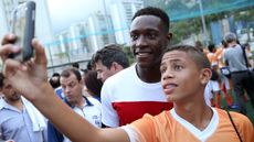 Danny Welbeck takes a selfie with a Brazilian fan at the World Cup