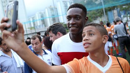 Danny Welbeck takes a selfie with a Brazilian fan at the World Cup