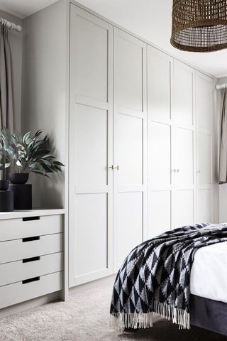 white built in wardrobe in bedroom