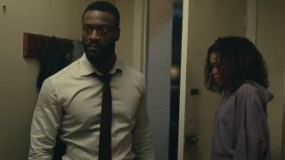 Aldis Hodge looking angry next to Storm Reid in The Invisible Man