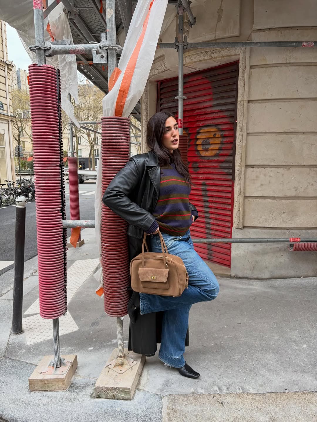 woman wearing leather trench coat jean outfit spring 2026