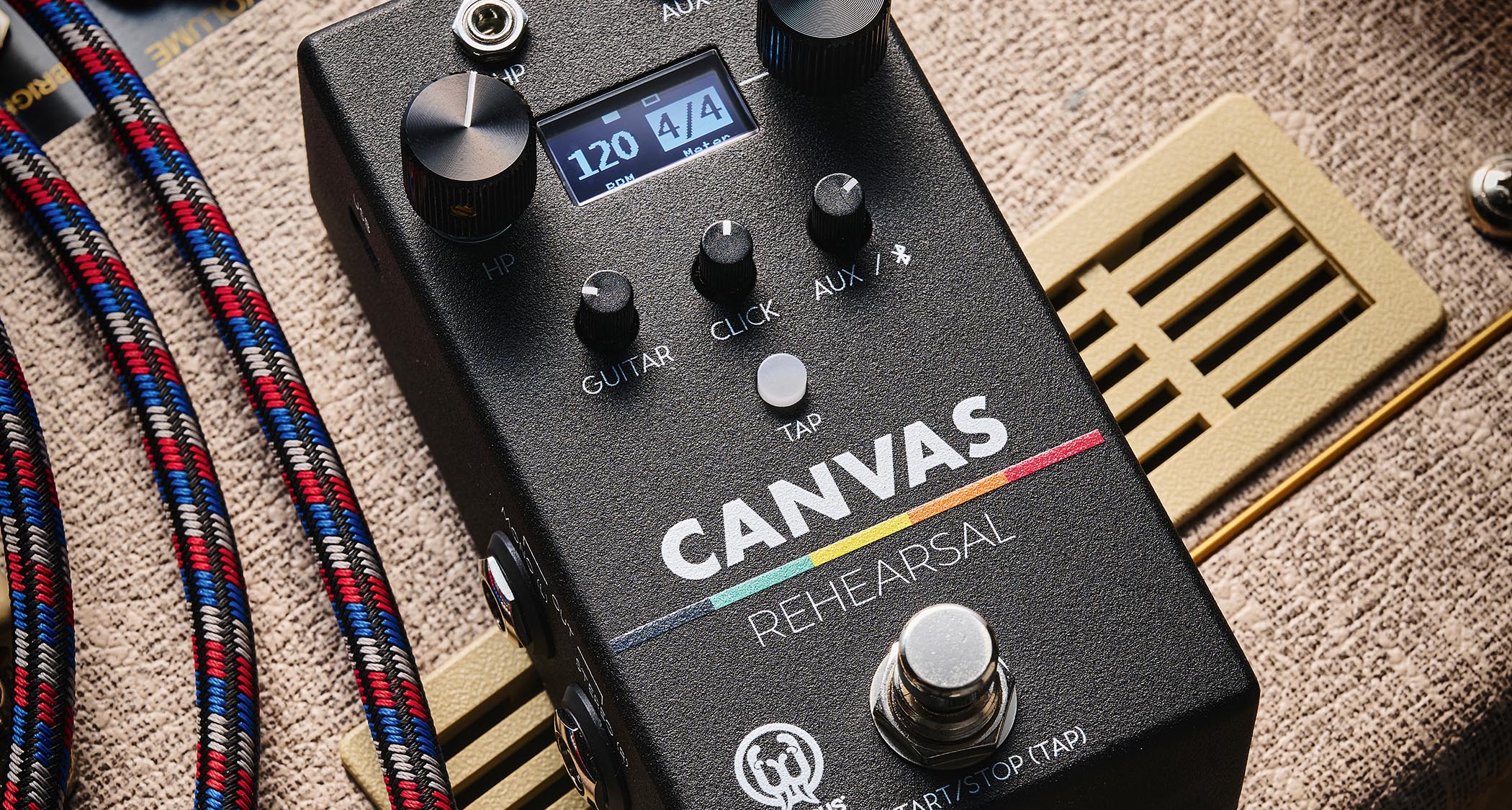 Walrus Audio Canvas Rehearsal: the compact black utility pedal is photographed against a fawn-covered Vox tube amp combo.